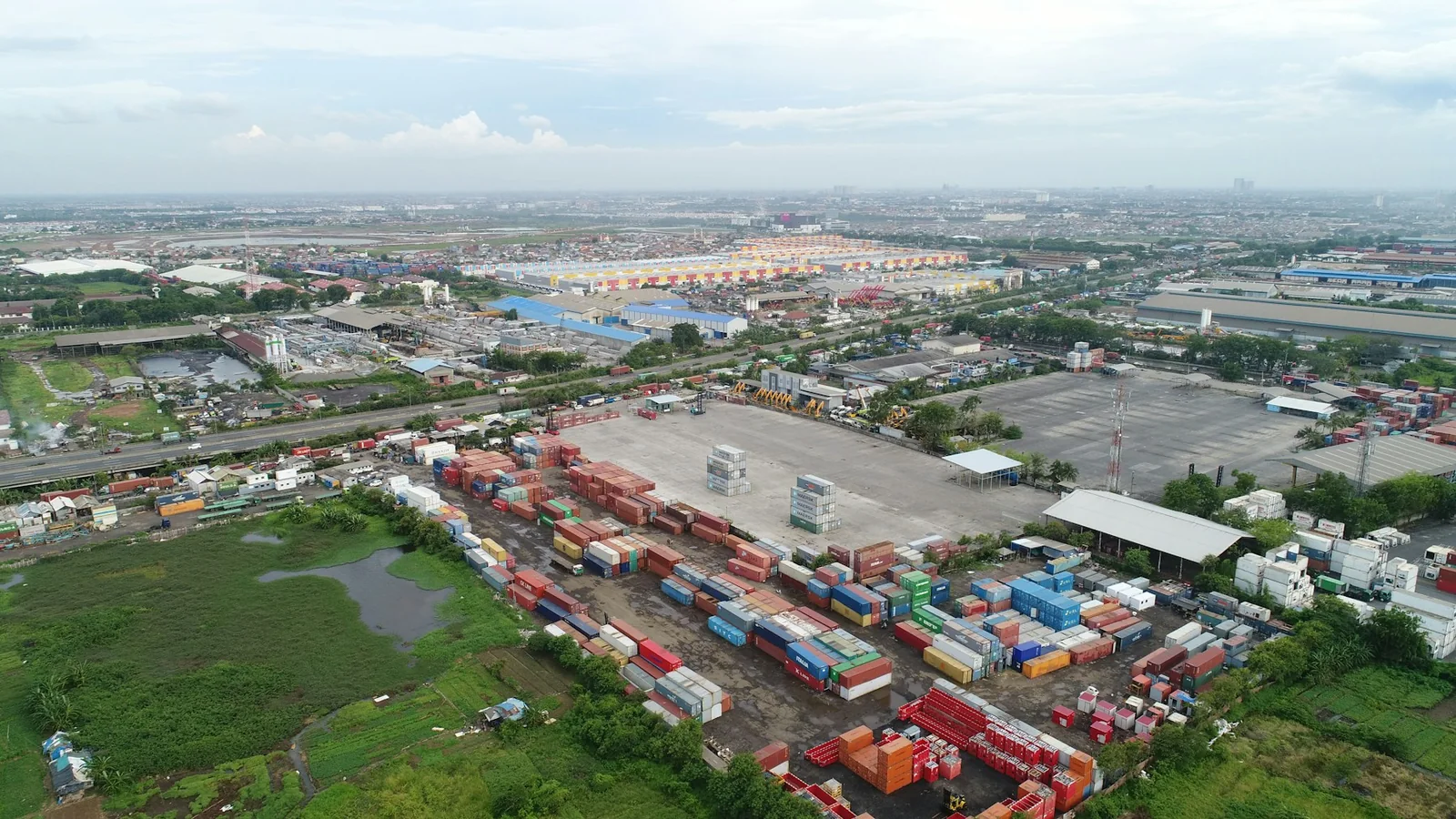 Aerial view of a Southeast Asian logistics and container hub