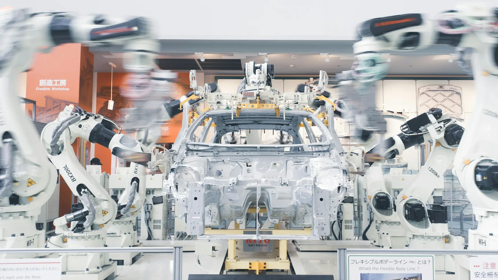 Robotic arms automating an automotive production line