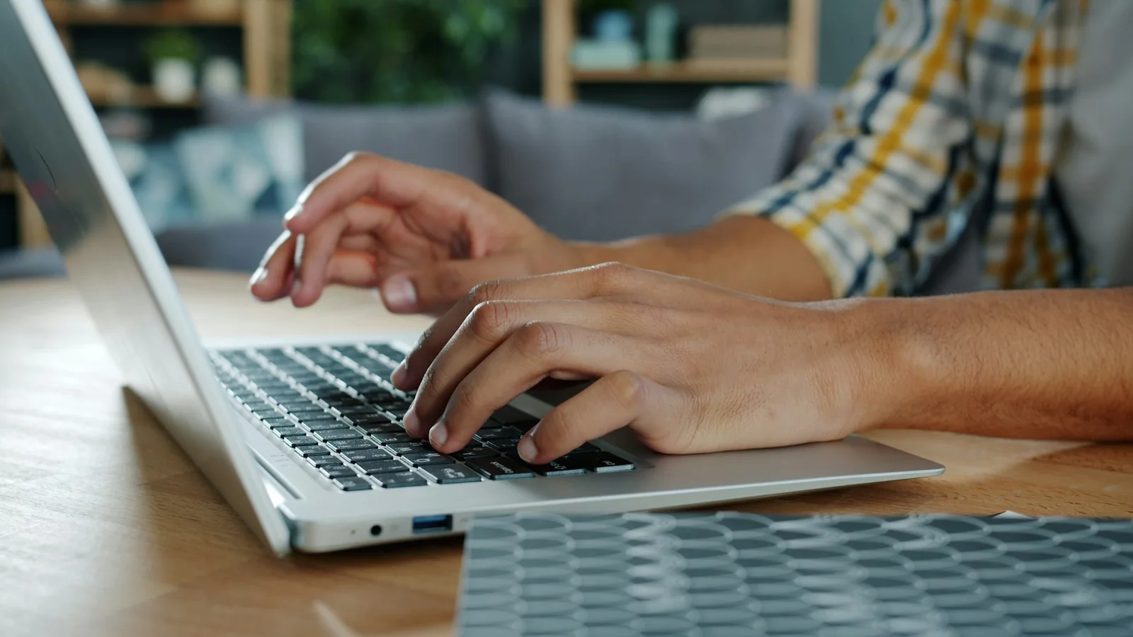 Content creator writing on a laptop